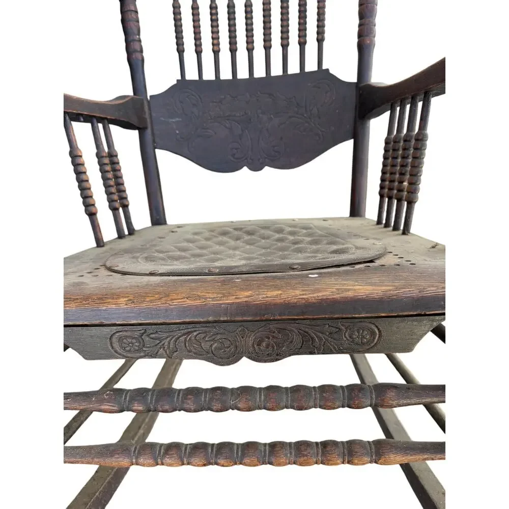 Antique Spindle Rocking Chair With Carvings and Cutout accent